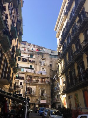 Corner alley of apartment facades in Naples, Italy in a sunny day