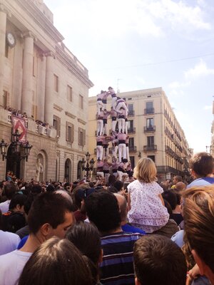 Crowd watching human towers in Barcelona Spain on a sunny day