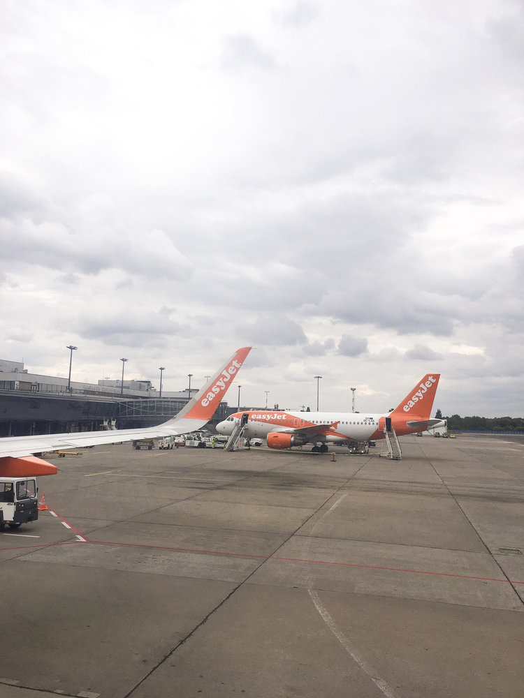 Budget airline Easyjet airplanes waiting on airport tarmac