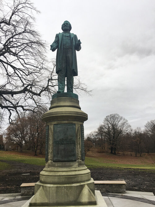 Black history site Fredrick Douglass Monument in Rochester New York on a rainy day