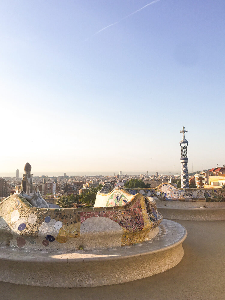Top of Antoni Gaudi’s Parc Guell with views of Barcelona Spain on a sunny morning