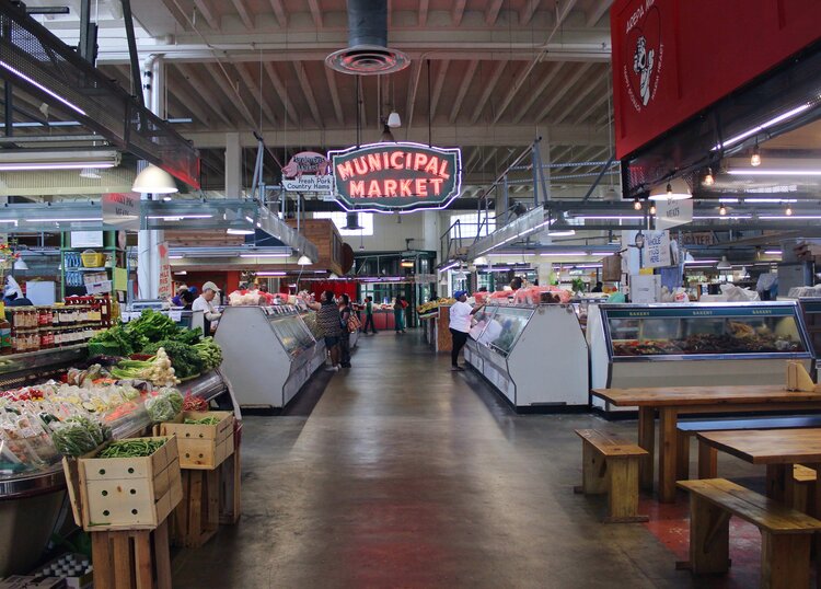 Inside of Sweet Auburn Curb Market with bright red Municipal Market sign