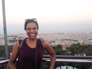 Kim standing in front of view of Barcelona at the top of Tibidabo