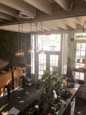 Inside the main entrance of Gilly Brew Bar with sunlight coming through in Atlanta, Georgia