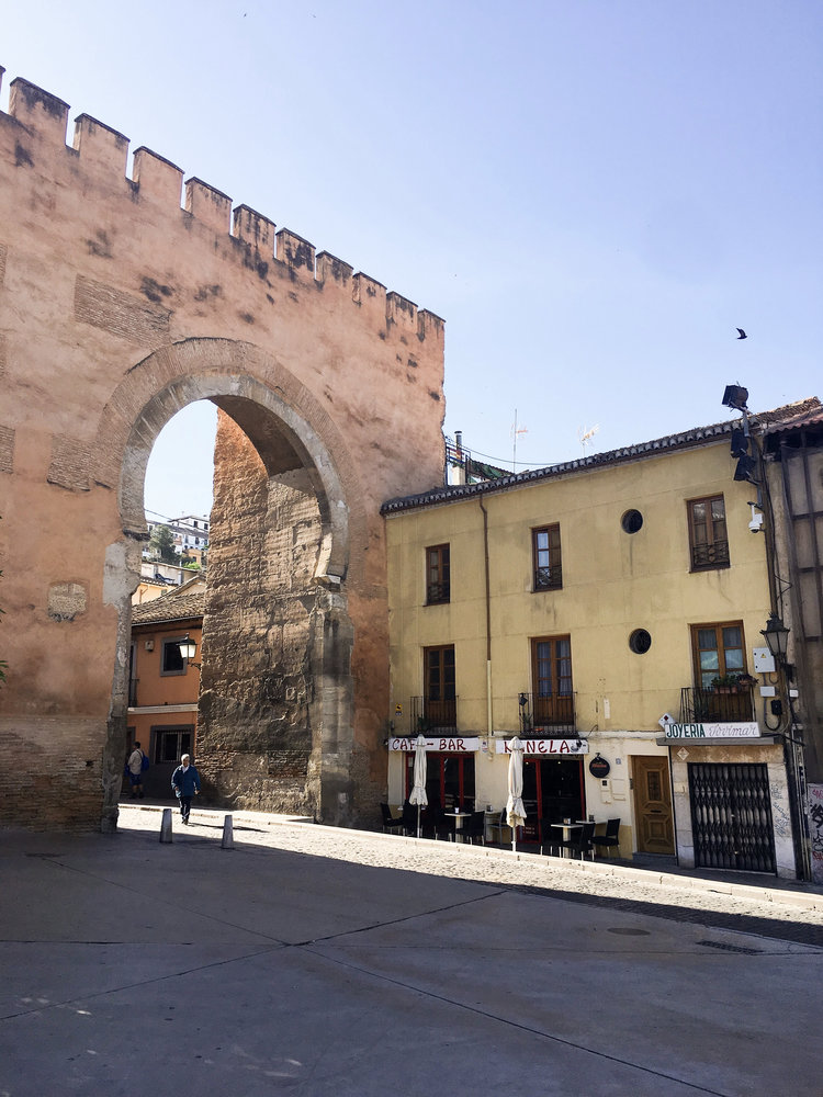 Outside the Gate of Elvira in Granada Spain on a sunny day for the perfect Granada travel guide.