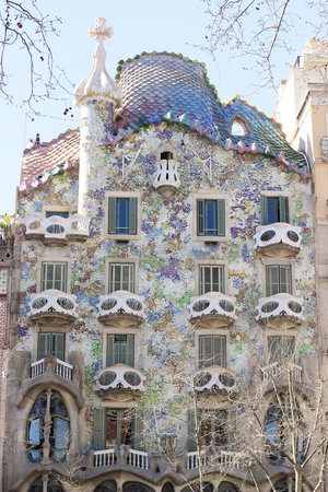 Right colorful facade of Antoni Gaudi’s Casa Battlo building in Barcelona Spain on a sunny day