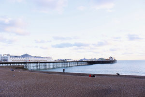 The beach and extended pier in Brighton Europe during sunset