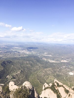 The views of Catalonia and the clouds from Montserrat Mountain on a sunny day in Barcelona