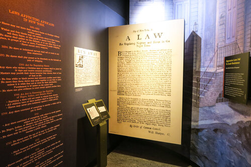 Wall of old text in the African Burial Ground Museum in New York