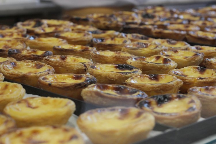 Lots of crispy pasteis de natas