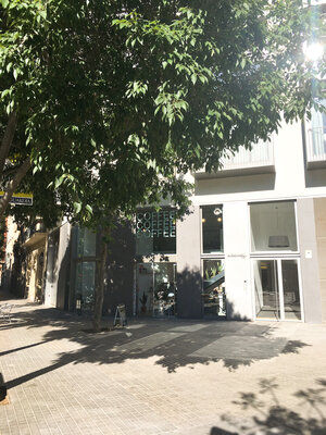 Outside of Three Marks coffee shop in Barcelona Spain in a bright and sunny day
