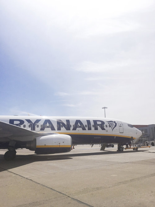 Ryanair airplane sitting on tarmac at airport on a sunny day