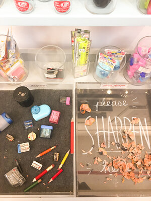 Store display at women owned business CW Pencil Enterprise with pencil shavings, pencils, and erasers