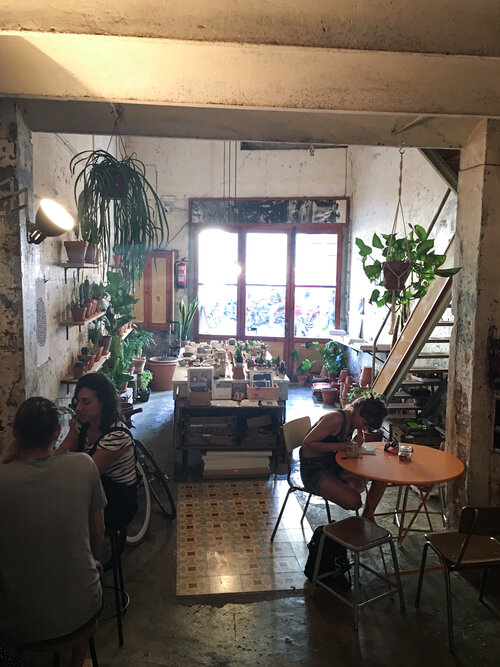 Customers sitting and enjoying the best coffee shop Espai Joliu