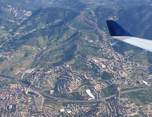 The views of Barcelona from above with a plane window in view