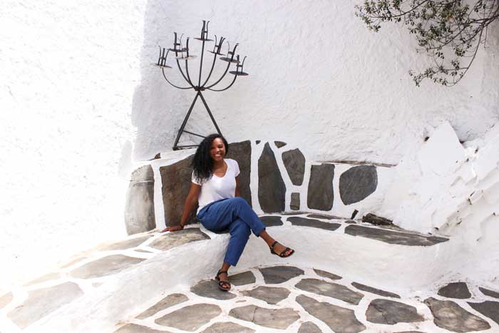 Kim sitting outside of Dali's house in Costa Brava on a sunny day