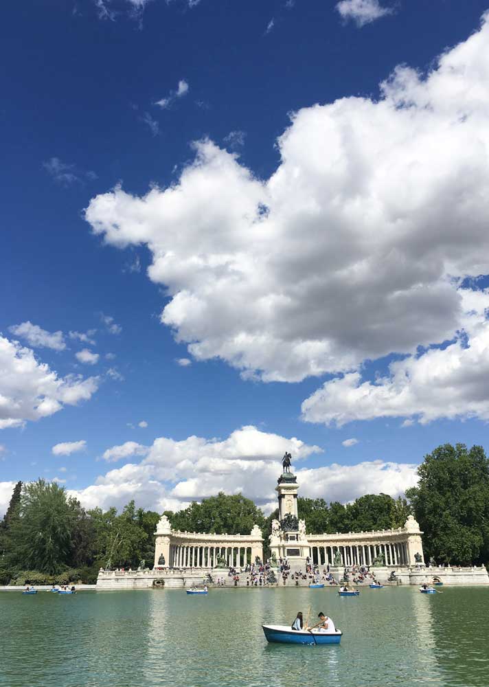 Tourists enjoying themselves at the lake in Buen Retiro Park in Madrid Spain