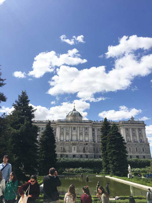 Tourists in front of Palacio Real in Madrid Spain on a sunny day